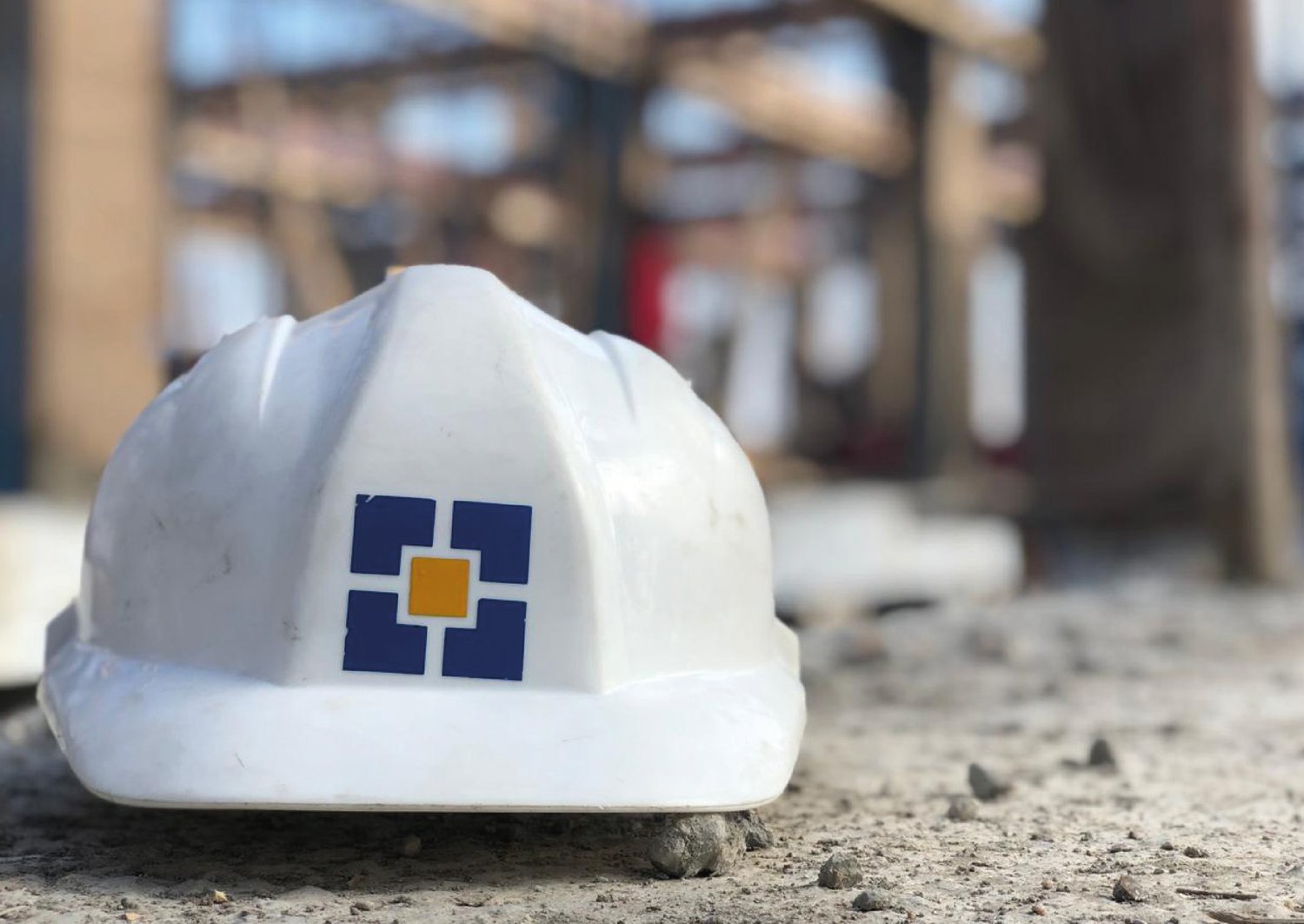 F.Co. Group branded hard hat on site